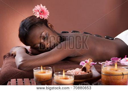 Woman Undergoing Lastone Therapy At Spa