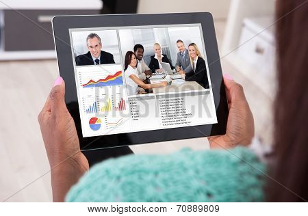 Businesswoman Video Conferencing With Colleagues From Home