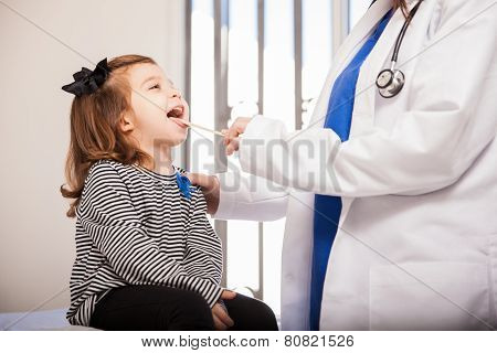 Little Girl Opening Mouth For Doctor