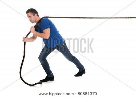 Portrait Of A Man Pulling Rope