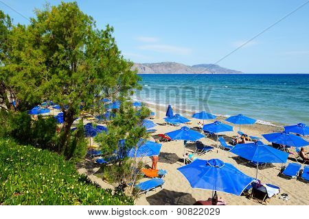 Crete, Greece - May 13: The Tourists Enjoiying Their Vacation On The Beach On May 13, 2014 In Crete,