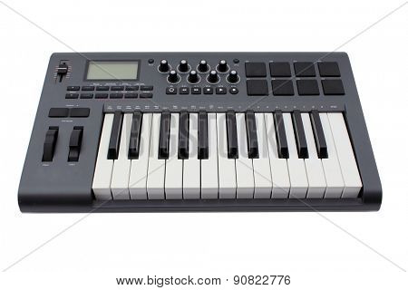 Detail of black and white keys on Axiom 25 MIDI music keyboard  isolated on white with room for your text. Music is loved by people and animals around the world and is as old as man kind.