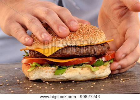 Cook hands preparing and making hamburger.