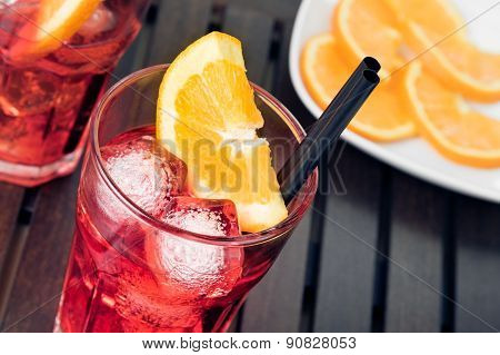 Close-up Of View Of Glasses Of Spritz Aperitif Aperol Cocktail With Orange Slices And Ice Cubes
