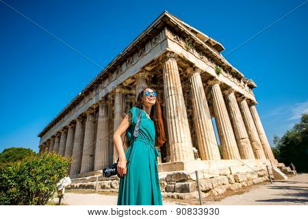 Woman with photo camera near Hephaistos temple in Agora
