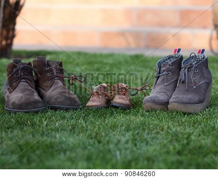 Shoes tied together mom and dad's son. The symbol of family love