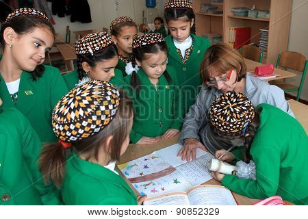 Ashgabad, Turkmenistan - November 4, 2014. Group Of Students After The Lesson In The Classroom . Nov