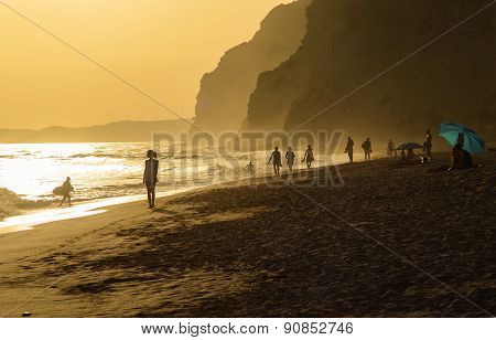 Women walking in the sunset