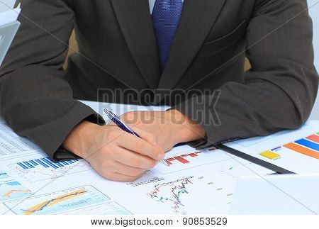 Businessman analyzing investment charts