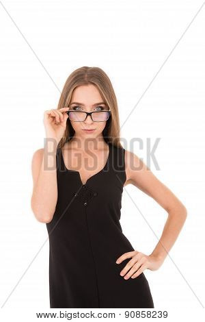 Serious Woman With Glasses. Girl In A Black Dress On A White Background