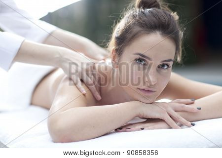Young woman getting a massage in a spa