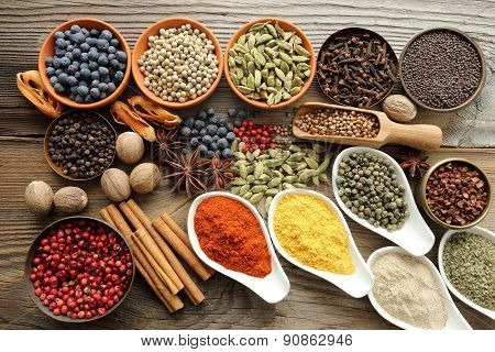 Aromatic spices in metal and ceramic bowls.