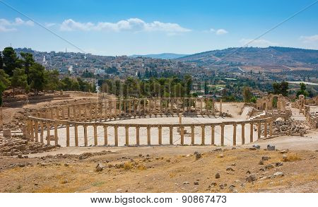 Ruins Of The Forum Cardo At Jerash Jordan With Modern City View
