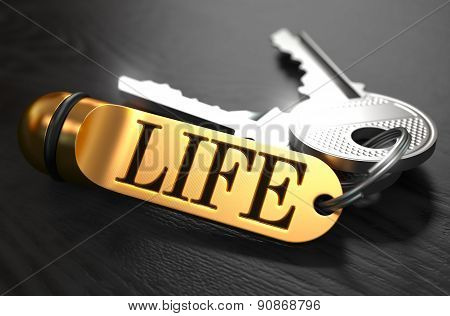 Life written on Golden Keyring.
