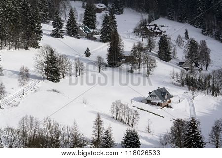 Frosty Snowy Country With Houses In A Sunny Winter Day