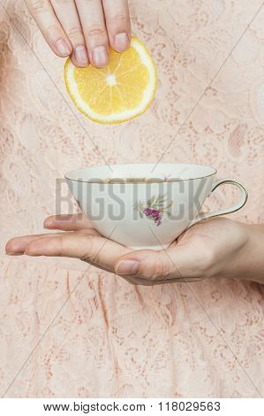 Woman Holding A Cup Of Tea