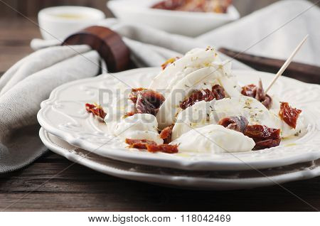 Traditional Italian Antipasto With Burrata And Dry Tomato
