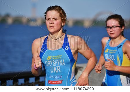 DNEPROPETROVSK, UKRAINE - MAY 24, 2014: Oleksandra Gryshyna and Olena Susol of Ukraine run on the third stage of ETU Sprint Triathlon European cup