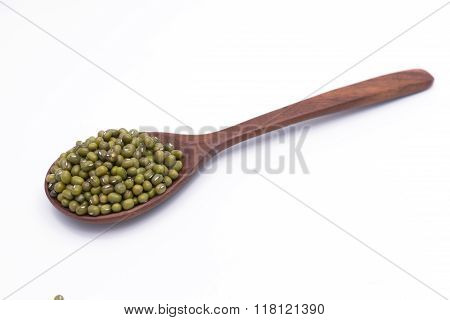Mung Beans Over Wooden Spoon On White Background