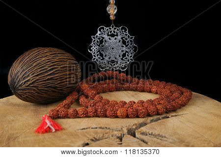 Indian Art - Mandala And Prayer Beards From Rudraksha On Teak Wood And Black Background