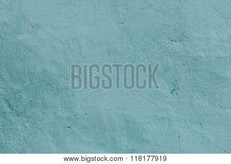 Grunge Background. Wall with the colored whitewash falling off fragment as a background texture