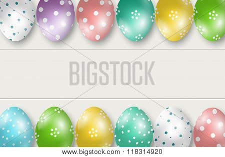 Colorful Easter eggs double edge border on white wooden background