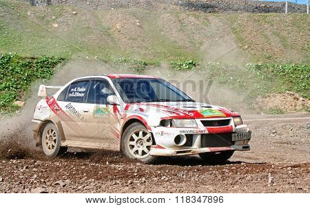 BAKAL, RUSSIA - AUGUST 8: Andrey Yadov's Mitsubishi Lancer Evolution (No. 12) competes at the annual Rally Southern Ural on August 8, 2008 in Bakal, Satka district, Chelyabinsk region, Russia.