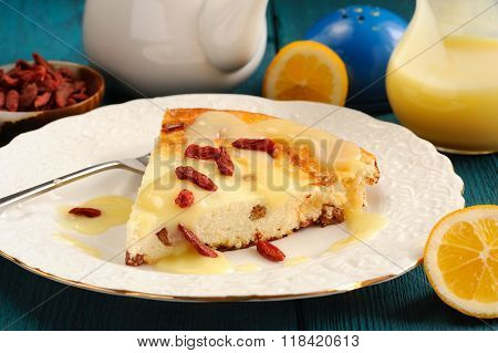 Homemade Cheesecake With Lemon Curd, Lemons And Goji Berries