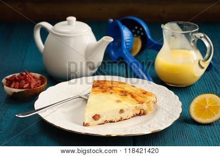 Homemade Cottage Cheese Cheesecake With Raisins, Lemon Curd, Tea And Goji Berries