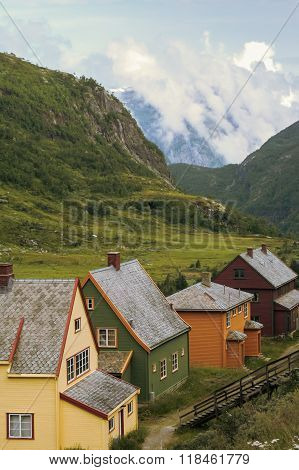 Country houses in village in Norwegian, fjords,landscape ,outdoors,vertical photo