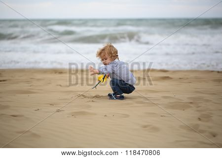 Boy Playing With Sand