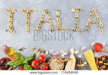 Italian food background with vine tomatoes, basil, spaghetti, parmesan Ingredients on stone table Co