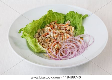 chicken salad, pickled cucumber and carrot on lettuce red onion round saucer top menu Series