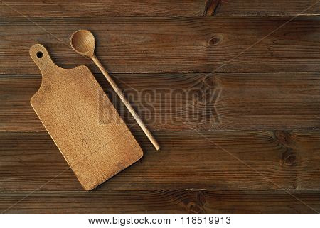 top view of wooden cutting board on old wooden table