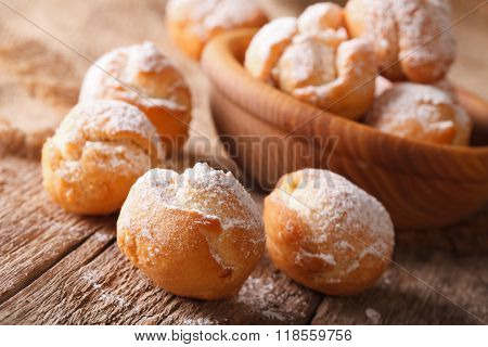 Italian Castagnole With Powdered Sugar In A Bowl. Horizontal
