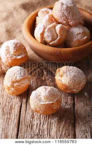 Italian Dessert: Fried Castagnole Close-up. Vertical