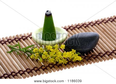 Aroma, guijarro y flor en Mat