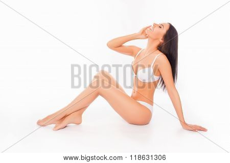 Cheerful Happy Model In White Underlinen Touching Her Face