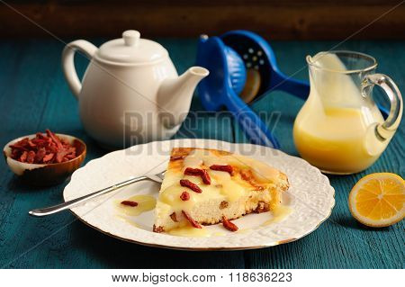 Yummy Homemade Cheesecake With Raisins, Lemon Curd And Goji Berries