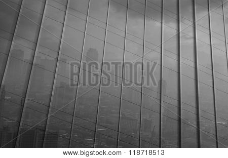 Reflection Of Big City In Metal Wall Of Office Building, Black And White Tone, Pollution Concept