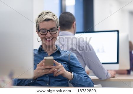 startup business, woman  working on dektop  computer at creative modern office relaxing and have fun