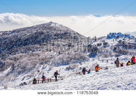 Tourists taking photos of the beautiful scenery around Deogyusan South Korea