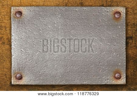 Vintage Steel Plate On Wooden Background