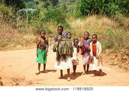 August 8 2014 - The children of Kilolo mountain in Tanzania - Kilolo - Africa - A group of unidentified children run at the arrival of the volunteers at the dispensary of Kilolo run by NGOs Mawaki where they will find food and medical care