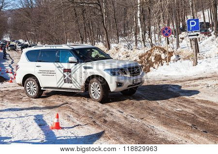 Vehicle Nissan Patrol Moving  In Sunny Day On The Rural Road