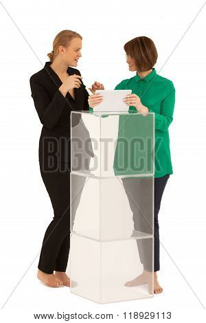 Two women looking to each other while talking