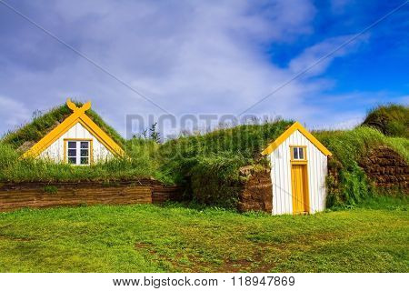 The reconstituted village - museum of the first settlers. Roofs of houses covered with turf and grass. The village ancestors in Iceland