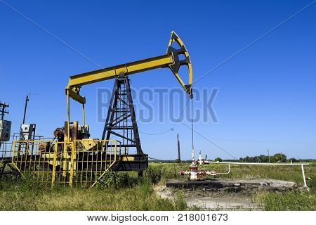 The Pumping Unit As The Oil Pump Installed On A Well. Equipment Of Oil Fields.