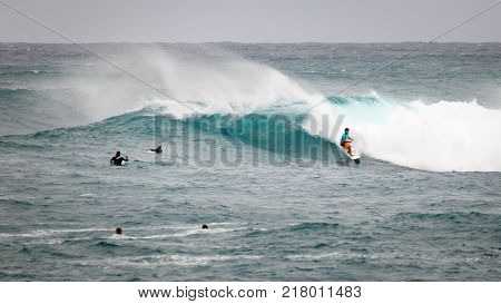 SUNSET BEACH HAWAII USA - DECEMBER 2, 2017: Surfer competing at the 2017 Vans World Cup of Surfing competition at Sunset Beach on Oahu's scenic North Shore. This is the second of three surfing competitions and Conner Coffin took first place.