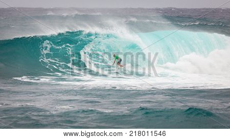 SUNSET BEACH HAWAII USA - DECEMBER 2, 2017: Surfer competing at the 2017 Vans World Cup of Surfing competition at Sunset Beach on Oahu's scenic North Shore. This is the second of three surfing competitions and Conner Coffin took first place.